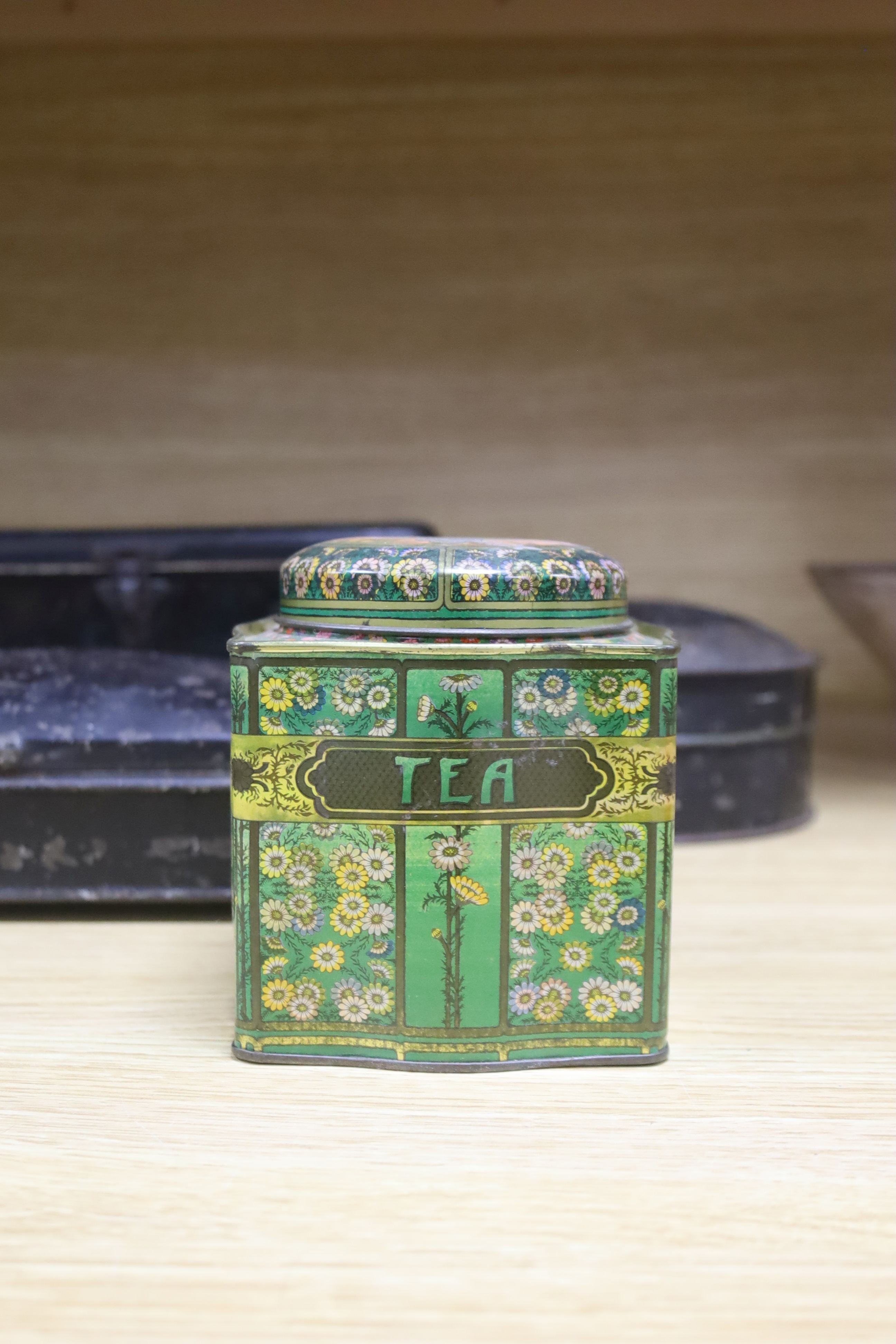 Two 19th century Toleware spice boxes, widest 20cm, and five storage tins